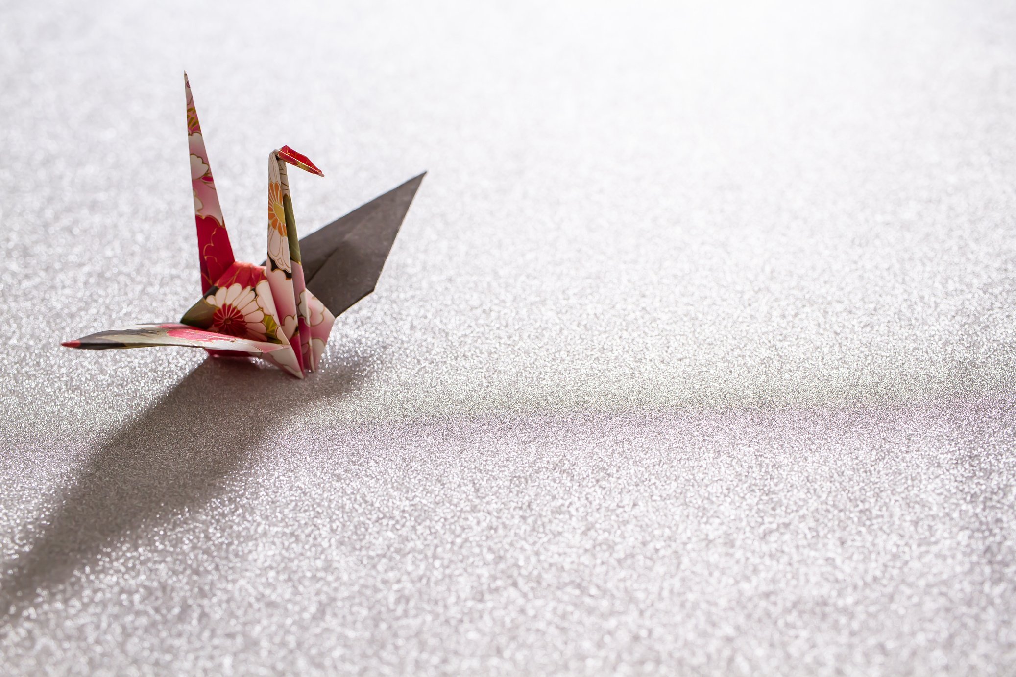Origami crane, Japanese style background.